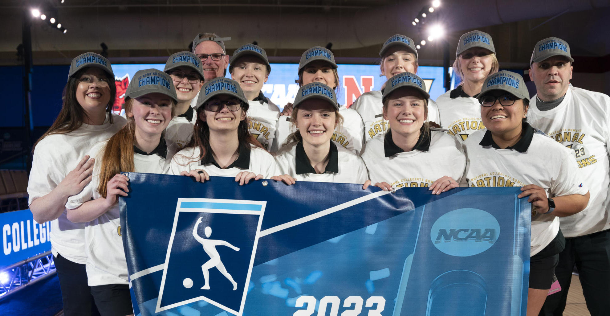 Vanderbilt Bowling team holding national championship banner