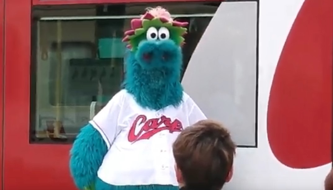 Furry blue creature (mascot) staring at camera