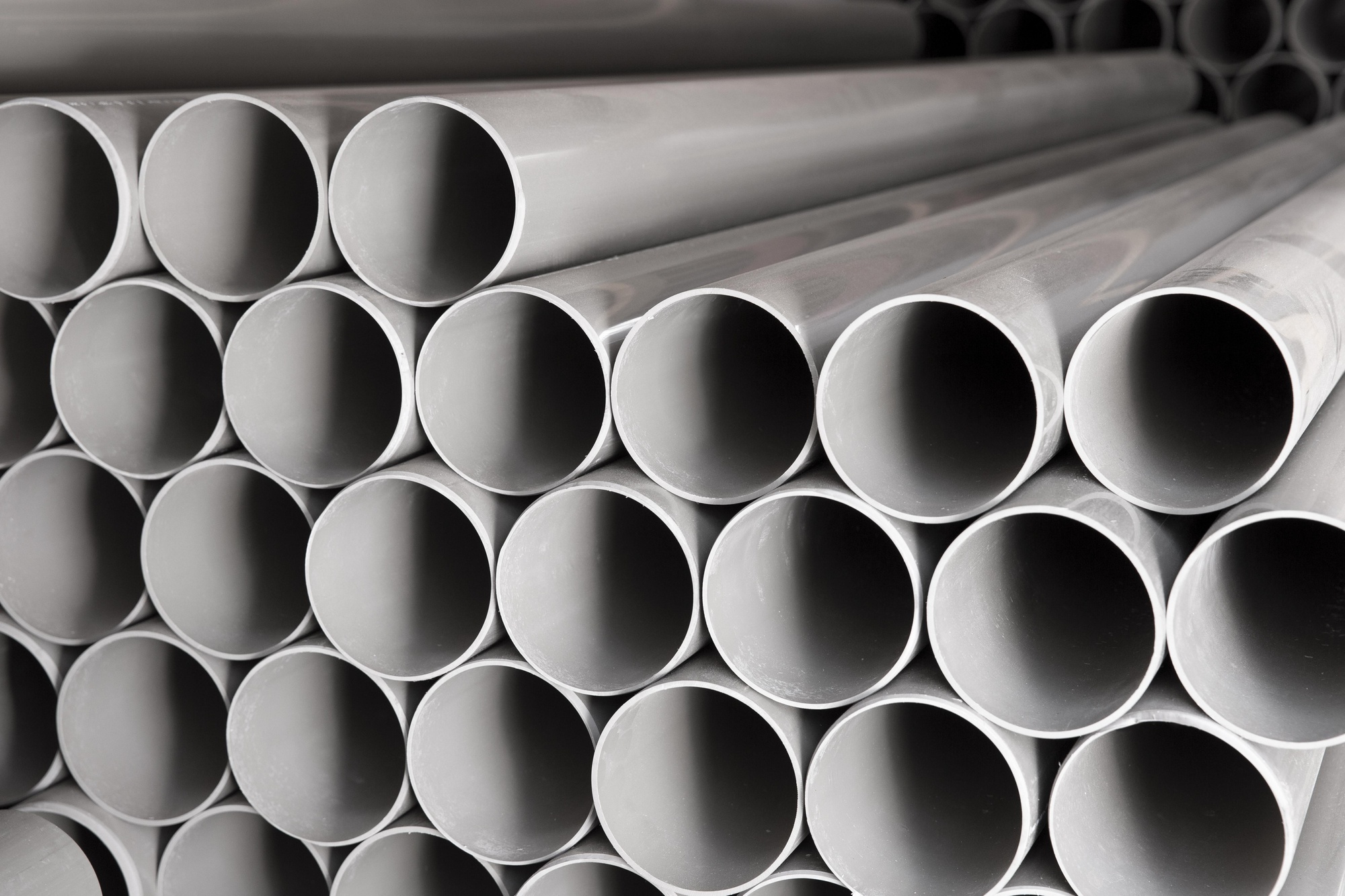 stack of aluminum pipes